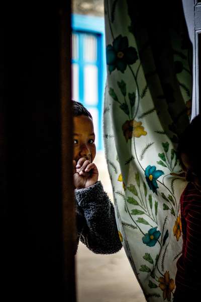 A child hides, Nepal