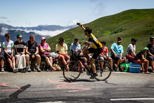 A fan takes a photo on the Col de Peyresourde - Tour de France 2017